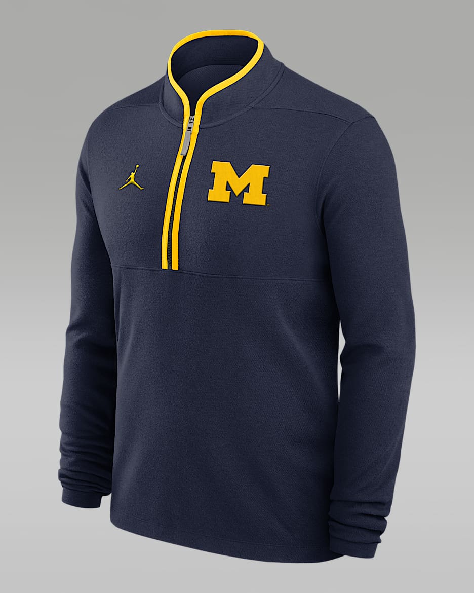 Michigan Wolverines Victory Men s Jordan Brand Dri FIT College 1 2 Zip Long Sleeve Top. Nike